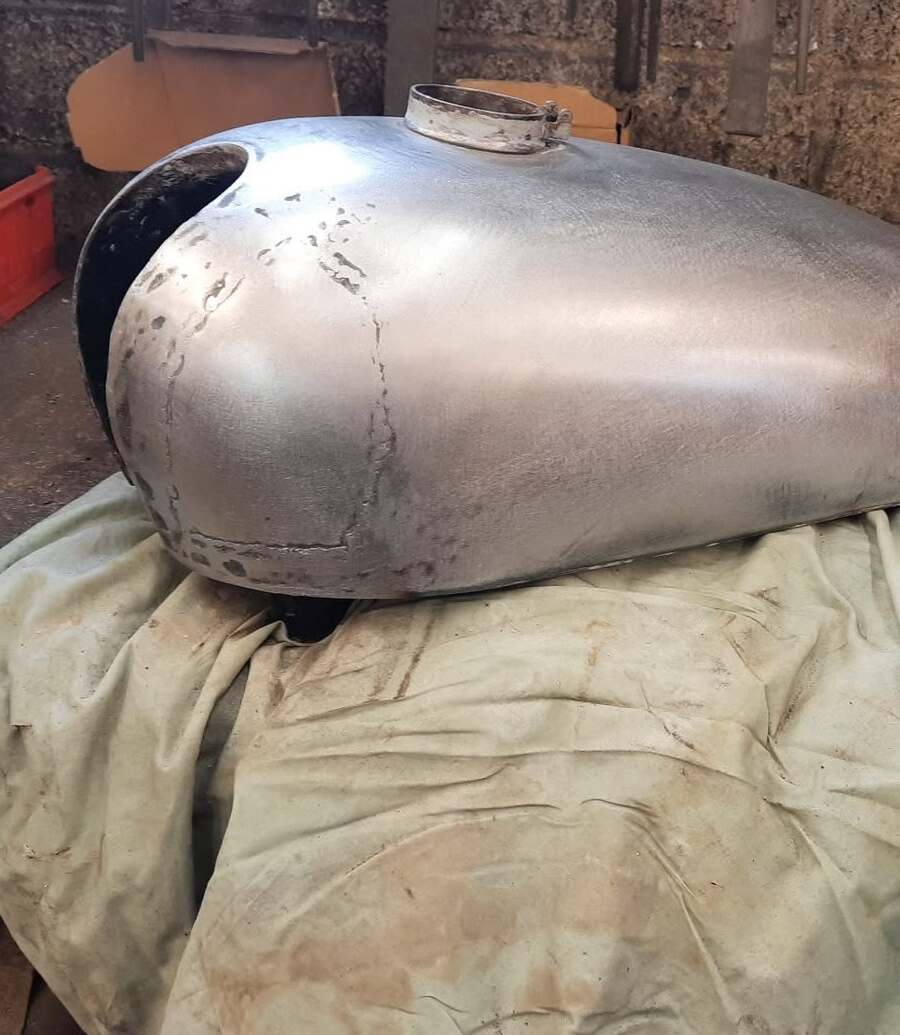 Motorcycle fuel tank hand-formed in bare steel