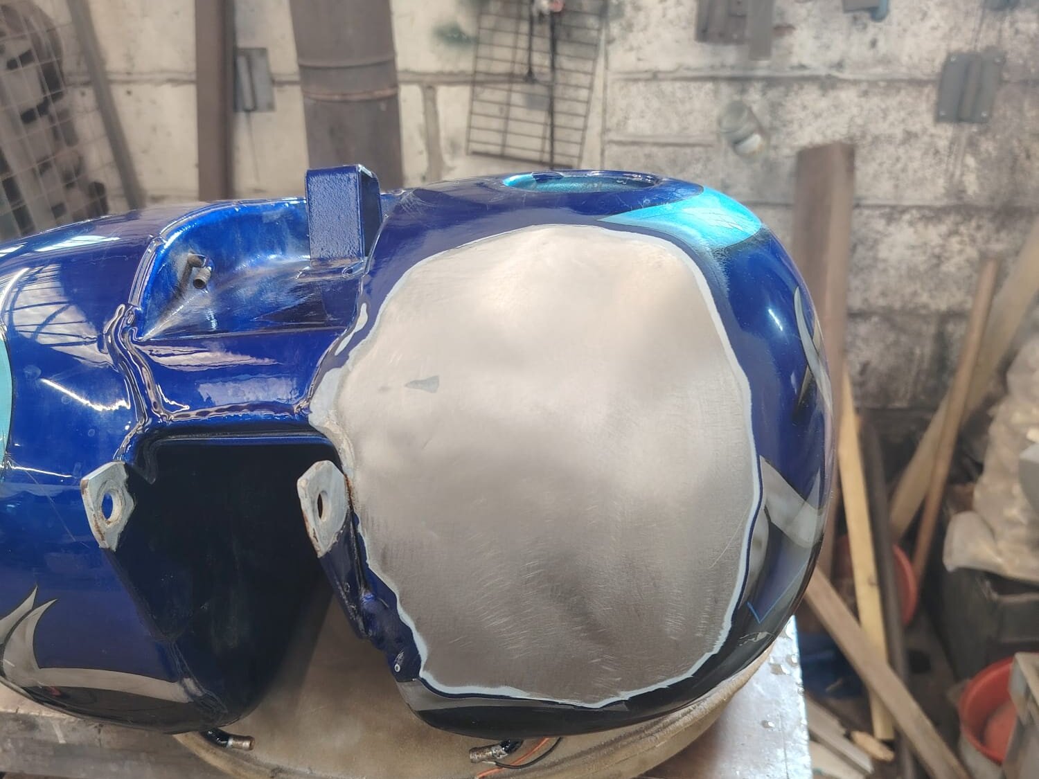 Harley-Davidson tank repaired, new metal beside the custom paint