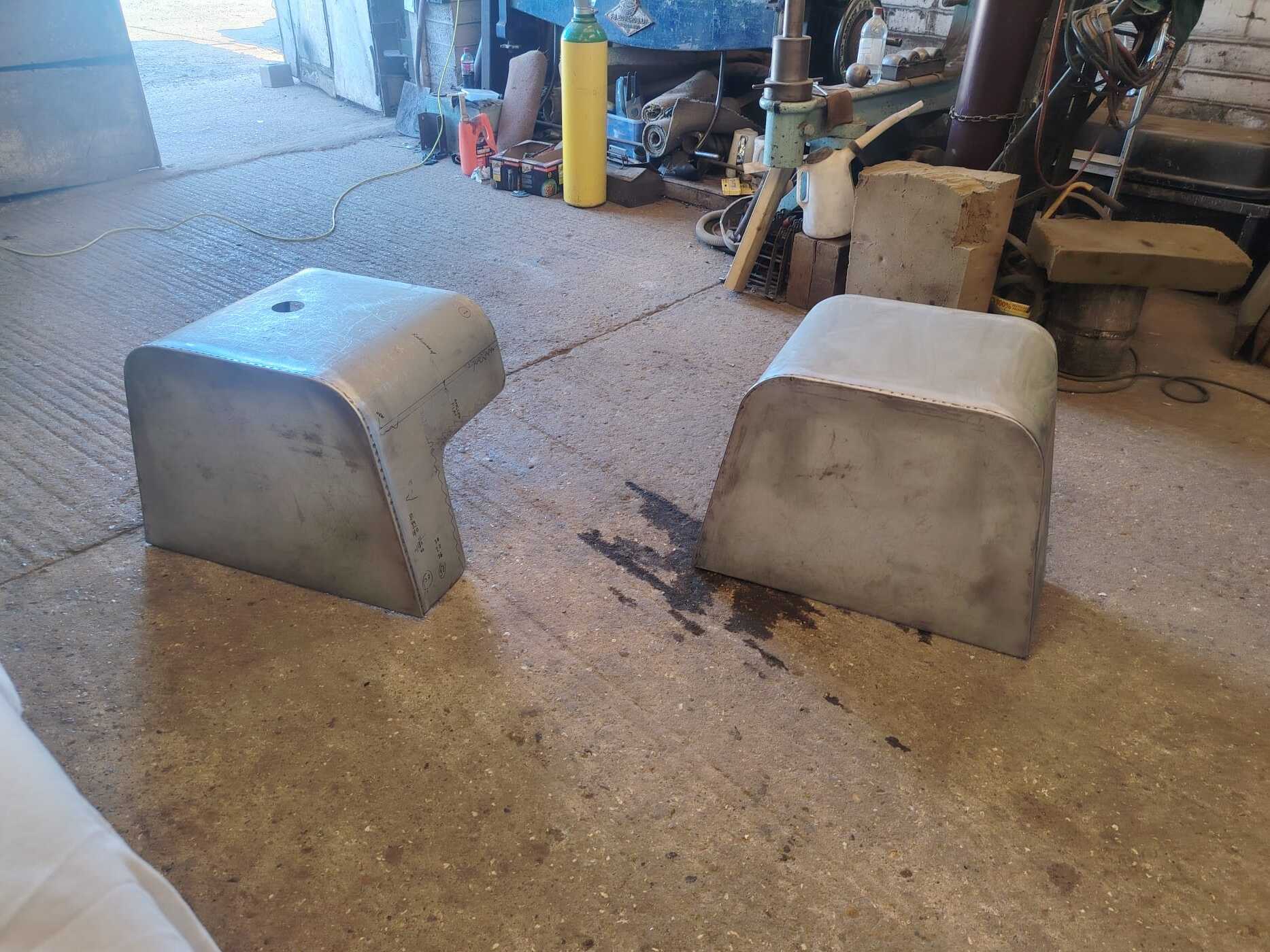 Pair of locomotive engine covers fabricated from a drawing
