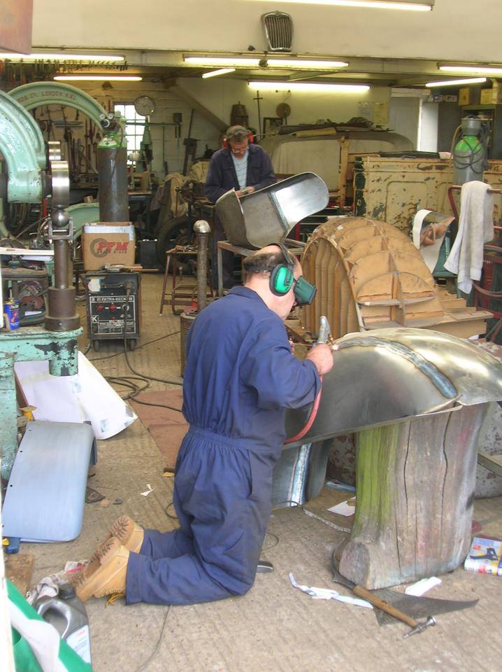 Shaping a panel by hand in the workshop
